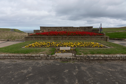 This is a floral tribute to the memory of Doris Ewbank on Whitley Bay seafront. Doris Ewbank, a former schoolteacher, was killed whilst driving a  wartime ambulance. Whitley Bay, North Eastern England, UK.