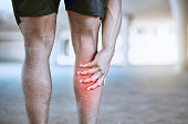 istock Sports man hand on a leg injury while training, exercise or workout. Red graphic to identify muscle ache or pain in the body after running accident outdoor. Athlete hurt after cardio fitness routine 1432151731