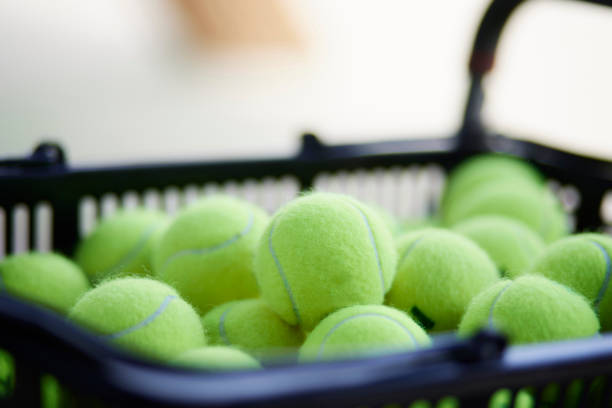 istock Many tennis balls in a basket 1432153247