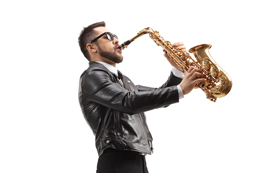 Man playing a saxophone and wearing sunglasses isolated on white background