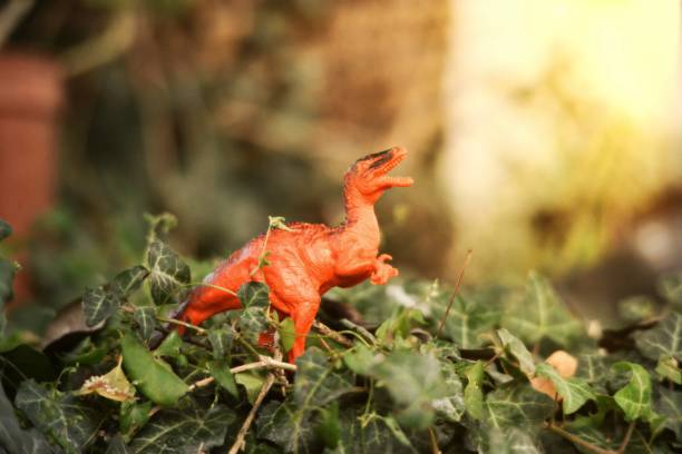 istock dinosaur plastic toy on natural background 1432158137