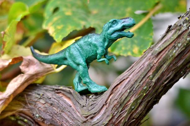 istock dinosaur plastic toy on natural background 1432158139
