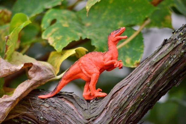 istock dinosaur plastic toy on natural background 1432158150