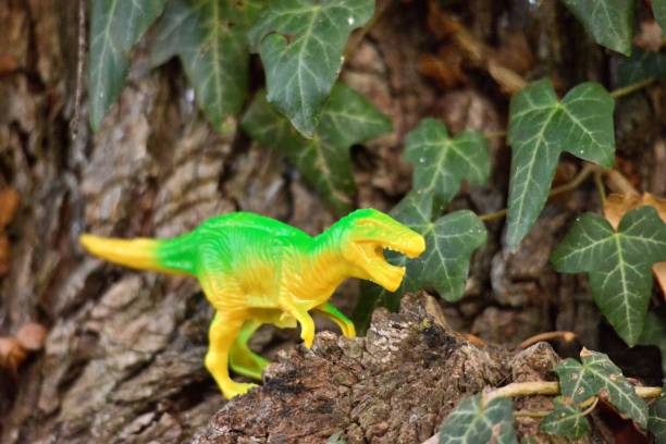 istock dinosaur plastic toy on natural background 1432158153