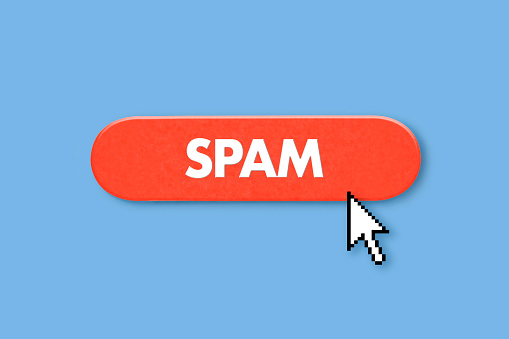 Red spam button with mouse cursor