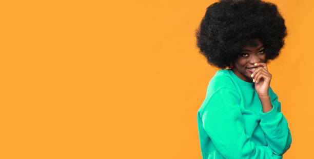 istock Very positive female model with afro hairstyle. 1432160343
