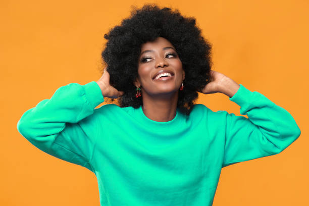 istock Very positive female model with afro hairstyle. 1432160355