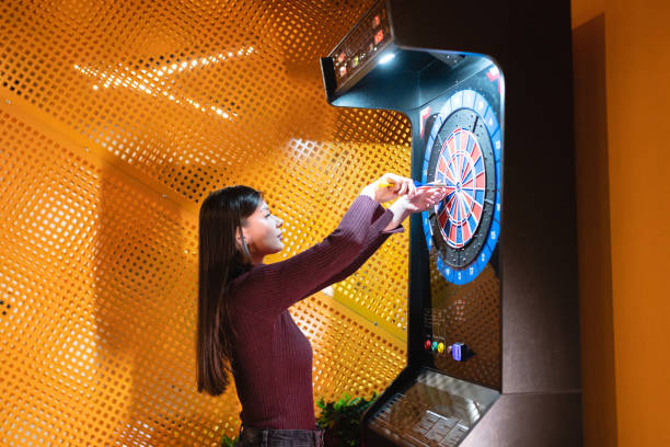 istock Young woman playing darts 1432160503