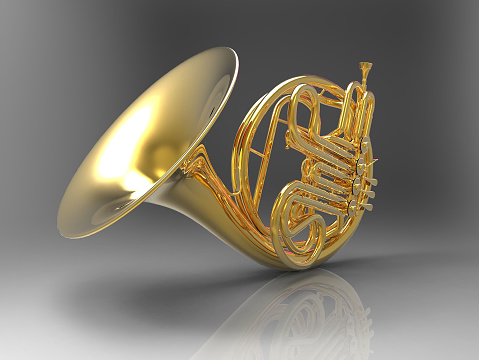Gold trumpet on white background