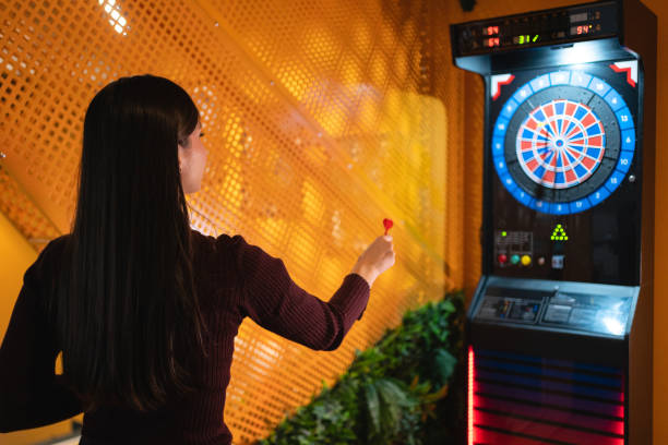 istock Young woman playing darts 1432161722