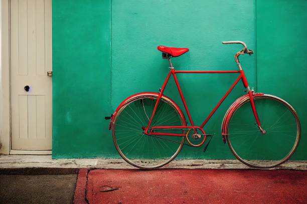 istock Red bike against a green wall 1432162169