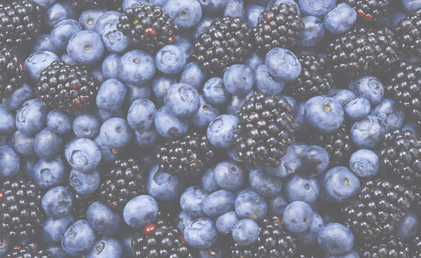 istock Blackberry and  blueberry background. Top view. 1432166511