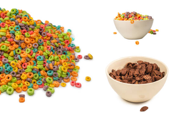 istock Chocolate corn flakes falling to the white bowl isolated on white. Motion. 1432166565
