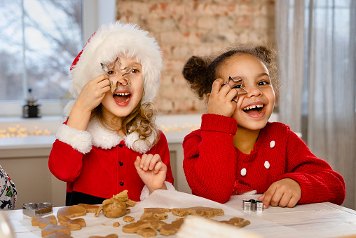 happy funny children bake christmas cookies
