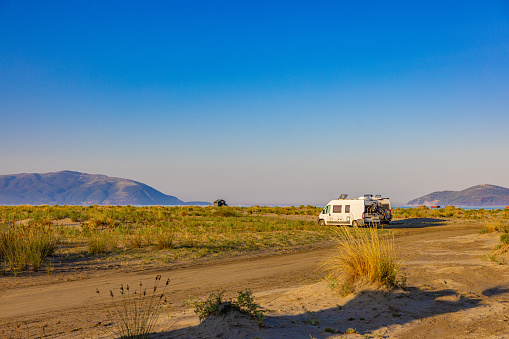 RV Car truck in desert parking lot. Road trip concept.