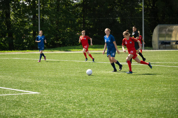 istock Football players playing on pitch 1432175505