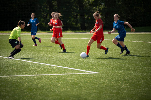 istock Female player kicking ball 1432175506