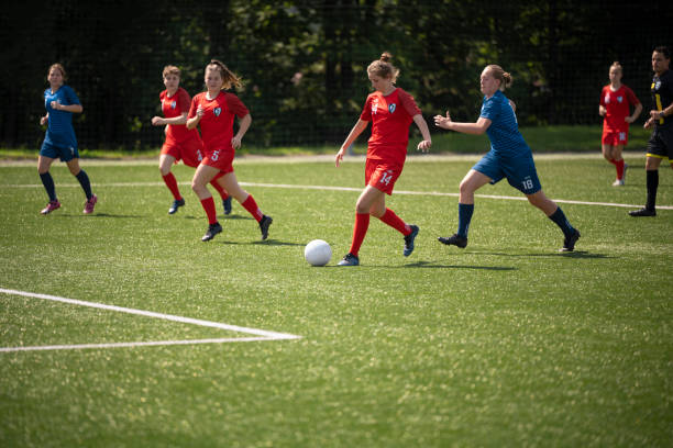 istock Football players playing on pitch 1432175510