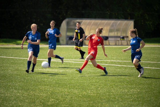 istock Football players playing on pitch 1432175515