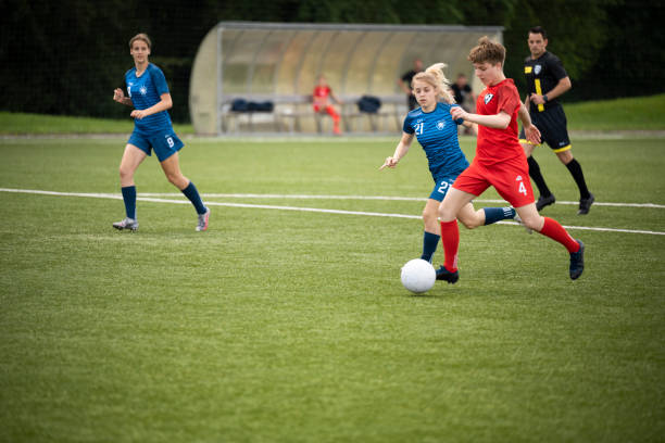 istock Female player kicking ball 1432175580