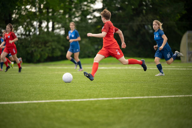 istock Female player kicking ball 1432175589