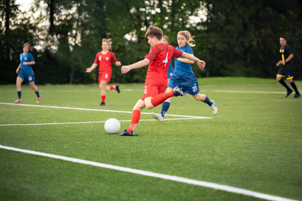 Female player kicking ball