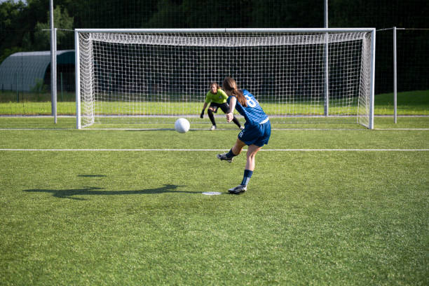 istock Player kicking ball at goal 1432175663