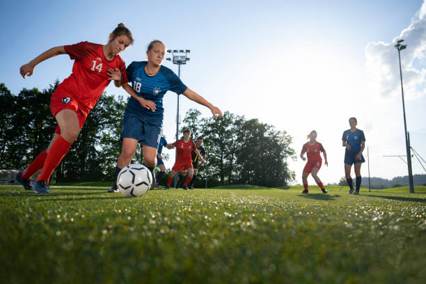 istock Female players kicking ball 1432175689