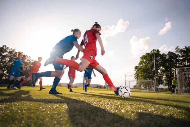 istock Female player kicking ball 1432175722