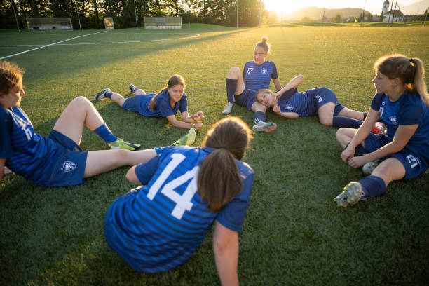 istock Football players resting after match 1432175862