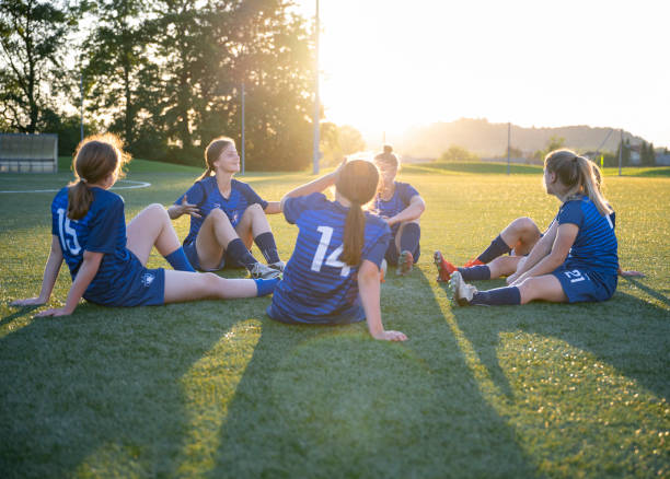 istock Football players resting after match 1432175864