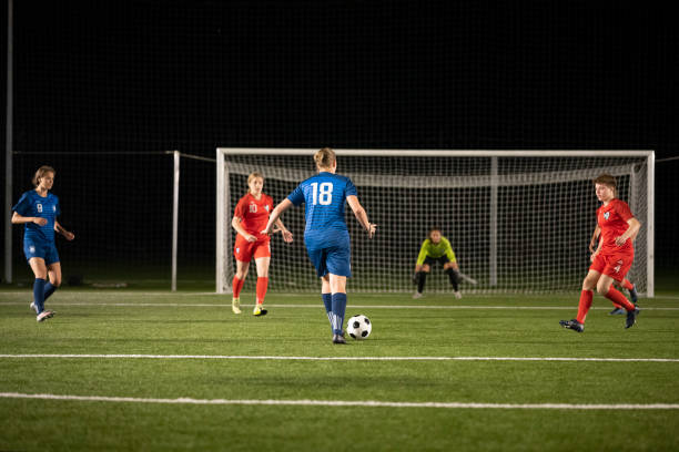 istock Football player running to kick goal 1432175951