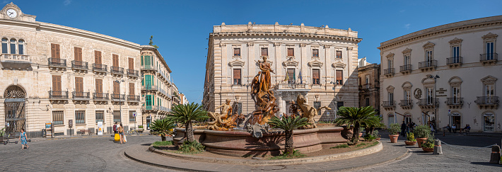 Syracuse, Italy - 09-16-2022: Extra wide view of Piazza Archimede in Syracuse with the beautiful Diana Fountain