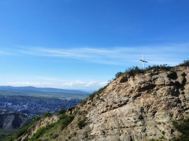 istock Christian cross on a mountain top 1432179406