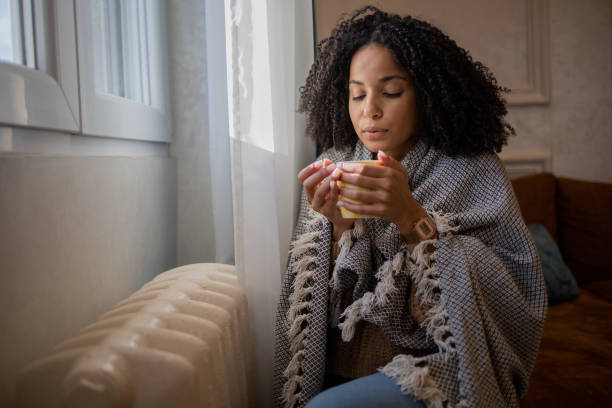 istock Woman feel cold in home with no heating 1432182999