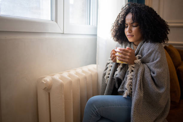 istock Woman feel cold in home with no heating 1432183000