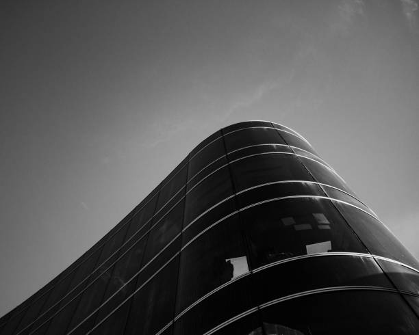 istock Low angle of a modern building against the sky shot in grayscale 1432186549
