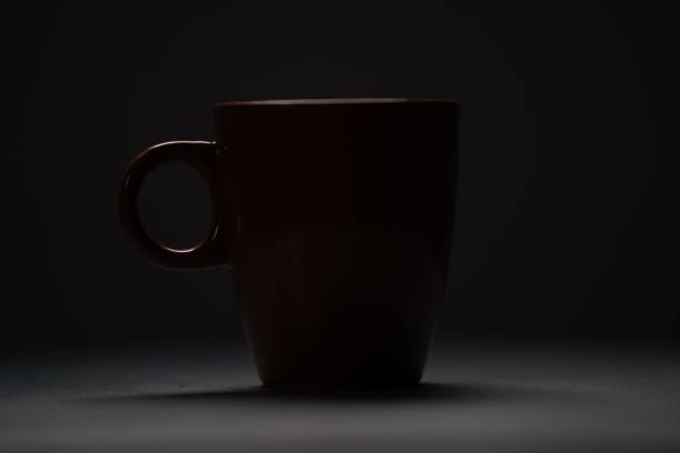 istock Dramatic shot of a cup of coffee on a table 1432187776