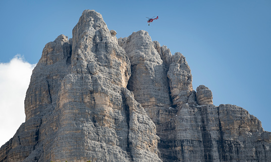 Rescue Helicopter at the famous Drei Zinnen, Tre Cime di Lavaredo, Dolomites, Italy