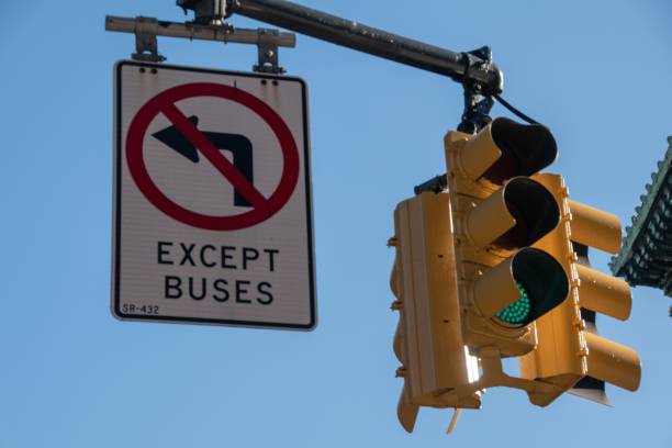 istock Except buses sign and a yellow traffic light. 1432193032