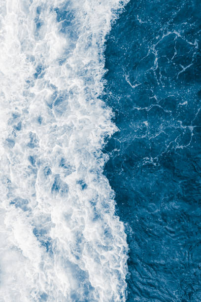 Dark blue sea ocean wave and  liquid white foam