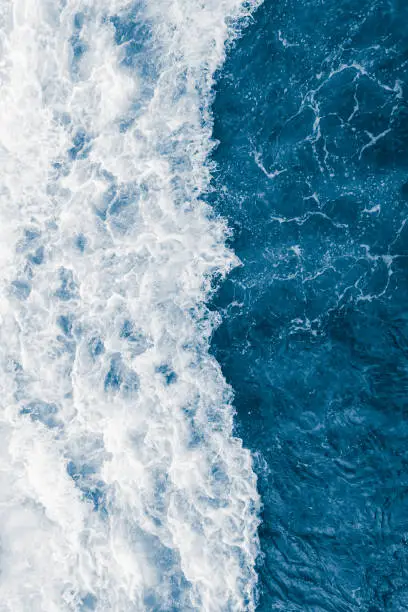 Dark blue sea ocean wave and  liquid white foam