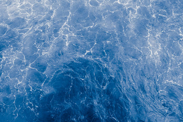 istock Blue purple sea surface with waves, splash and bubbles 1432193415