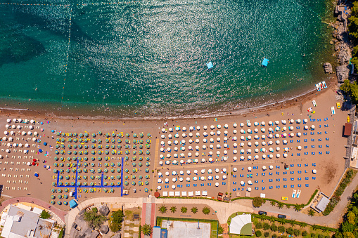 Beautiful view of umbrellas on sandy beach at sea coast during sunny summer day