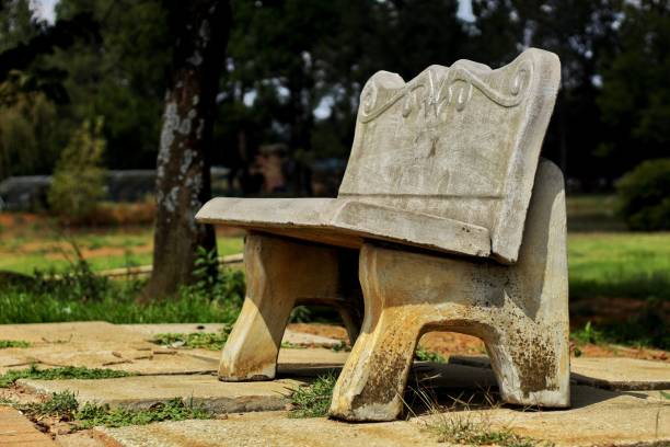 istock Old marble bench in a garden on a sunny day 1432198759
