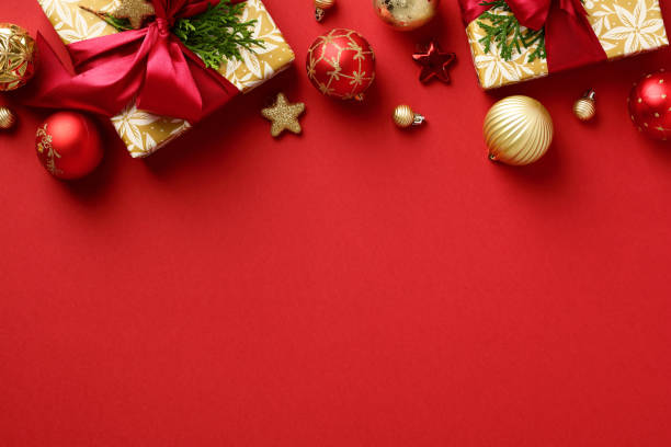 istock Christmas frame. Gift boxes and luxury Xmas ornaments on red table. Flat lay, top view, copy space. 1432198897