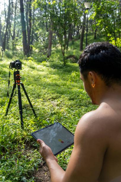 istock Young man drawing on his tablet, while teaching chakra, yoga, and meditation class 1432203619