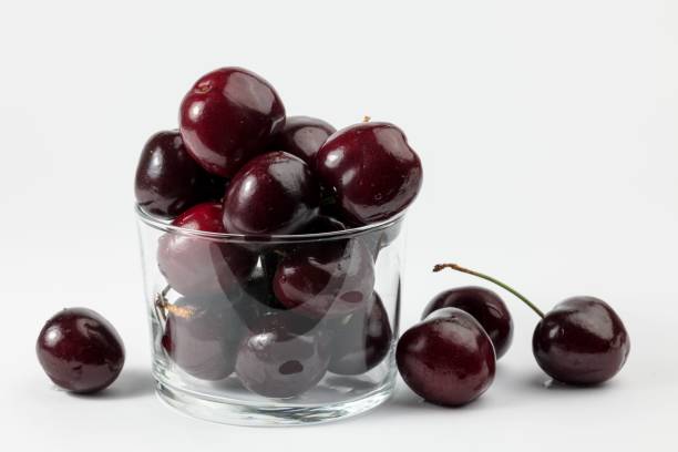 istock Few delicious cherries on white background. 1432204520