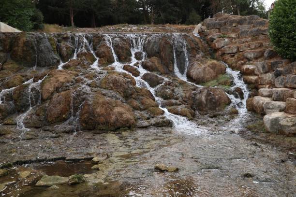 istock Rocky waterfall flowing downstream in a forest 1432206195