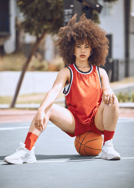 istock Basketball player with funky, confident and cool attitude ready for competition, game or training match on a sports court. Portrait of young woman, healthy athlete and afro female ready for fitness 1432206438